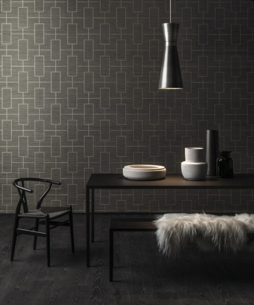 For this design we've lasered a dotted pattern on an abaca wallcovering. The silver dots create a stunning room. Here combined with a Wegner Wishbone chair.