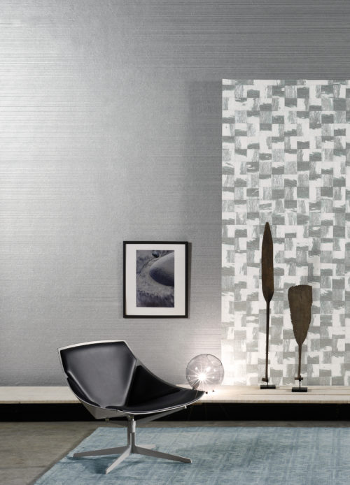 Arty room in silver and white with some contrasting furniture: lounge chair, glass ball lamp, painting. The Kaleidoscope and Rainbows wallcoverings connects it all.