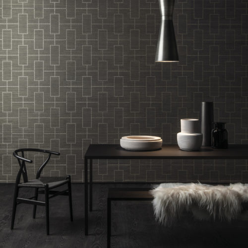 For this design we've lasered a dotted pattern on an abaca wallcovering. The silver dots create a stunning room. Here combined with a Wegner Wishbone chair.