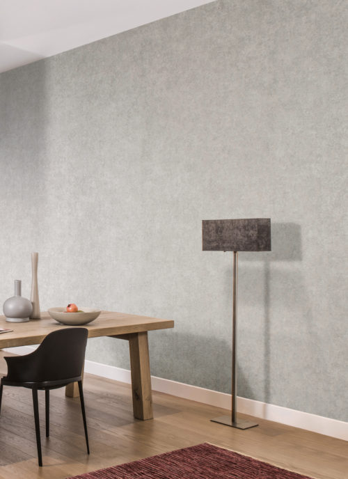 In this home, Kaleidoscope wallcovering are used in the dining room. Soft pastel tones are in constrast with the black chair and standing lamp.