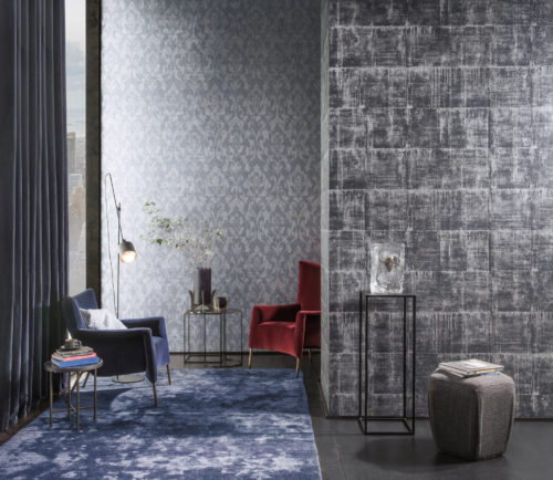 Room with large window and velvet curtain in the city. Red and blue velvet armchairs. Silver and white Antarès wallcovering on both walls.