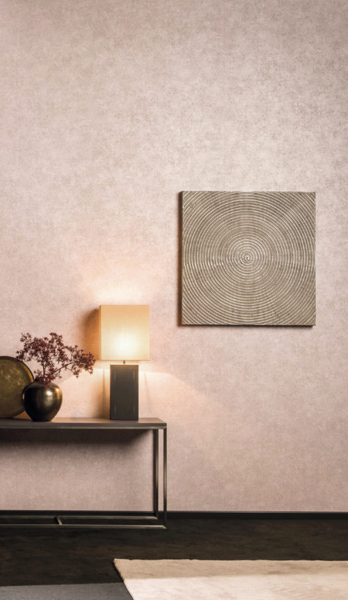The square standing lamp on the console makes the pink Kaleidoscope wallcovering blush. Square artwork with circles. Pink carpet.