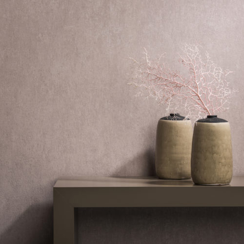 How beautiful pink can be: Borneo wallcovering in soft pastel pink. In harmony with sepia side board. Two decorative vases, one with a pink branch.
