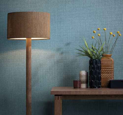 Colour contast between the blue from the Aruba wallcovering and ocre lamp and vases.
