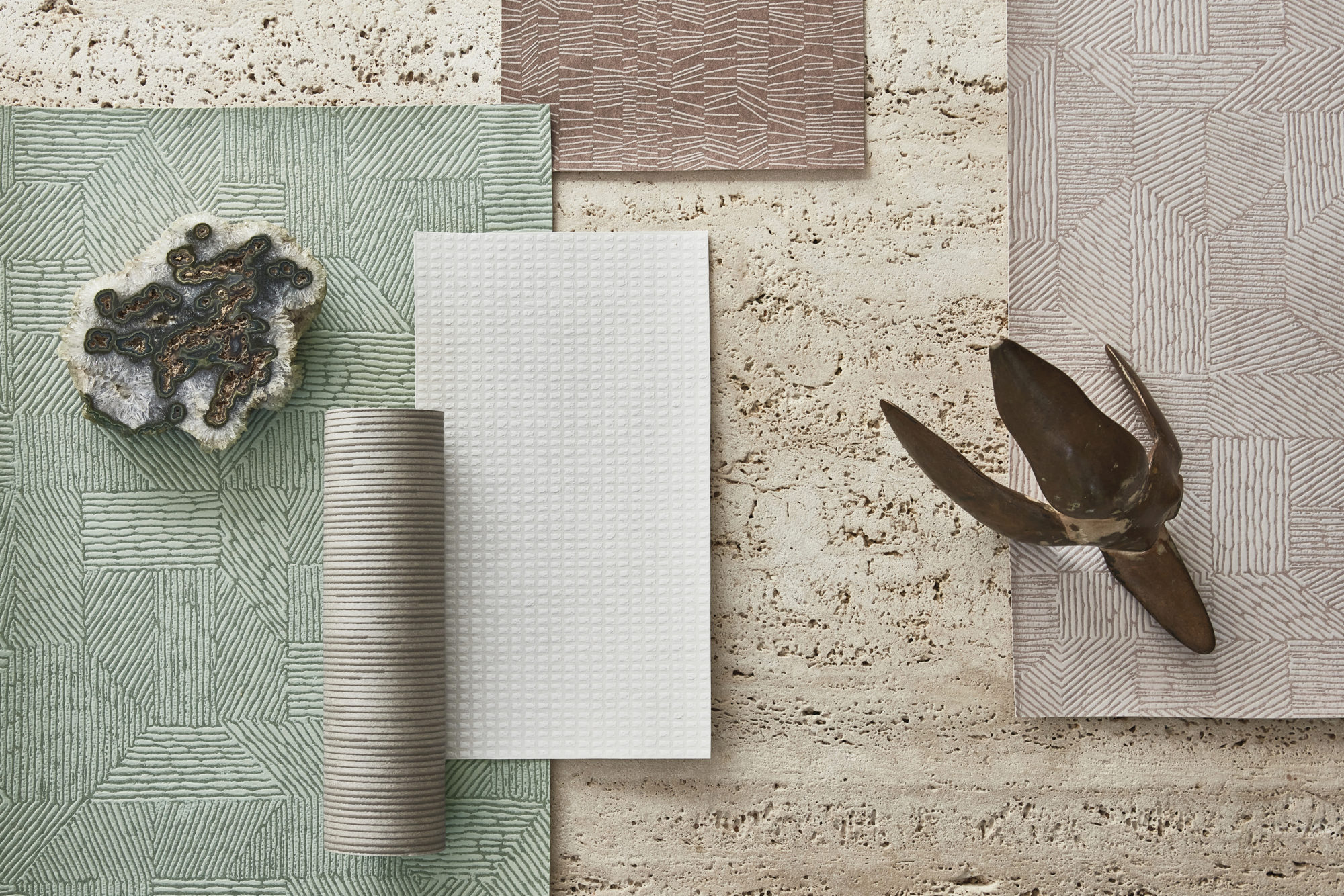 An image of a moodboard with samples from Omexco's high performance collection Rivage, in soothing shades of white, beige and green.  These wallcoverings are not only PVC-free and bleach cleanable, but now have an enhanced performance with scrubbability.