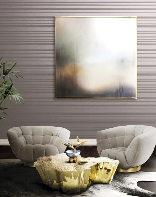 Tactile room with velvet chairs that make you think of hands to sit on. Vague pastel work of art, pink striped Infinity wallcovering.