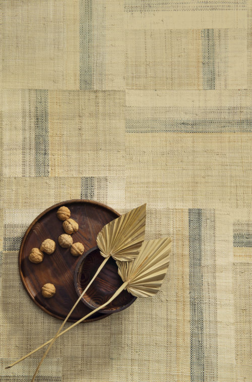 Handwoven raffia squares form a striking beige patchwork in Boro style, reflecting Omexco's love and passion for authentic craftsmanship.