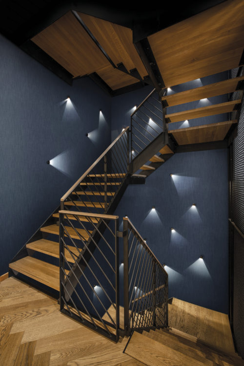 Stairs and hallway inspiration idea: denim coloured wallcoverings from our eco-conscious High Performance Textures collection. For commercial as well as residential projects. Inspired by the technique used for jeans manufacturing with diagonal ribbing as a result.