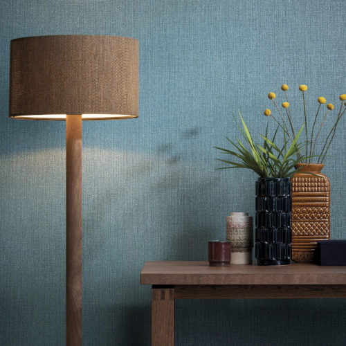 Colour contast between the blue from the Aruba wallcovering and ocre lamp and vases.
