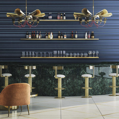 Green marble bar with golden bar stools. Two eyecatching golden lamps with red electric cords. Glasses and bottles behind the bar. Blue striped Infinity wallcoverings.